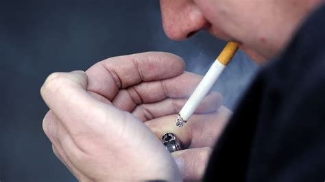Smoking ban in pub gardens and outdoor venues being  .